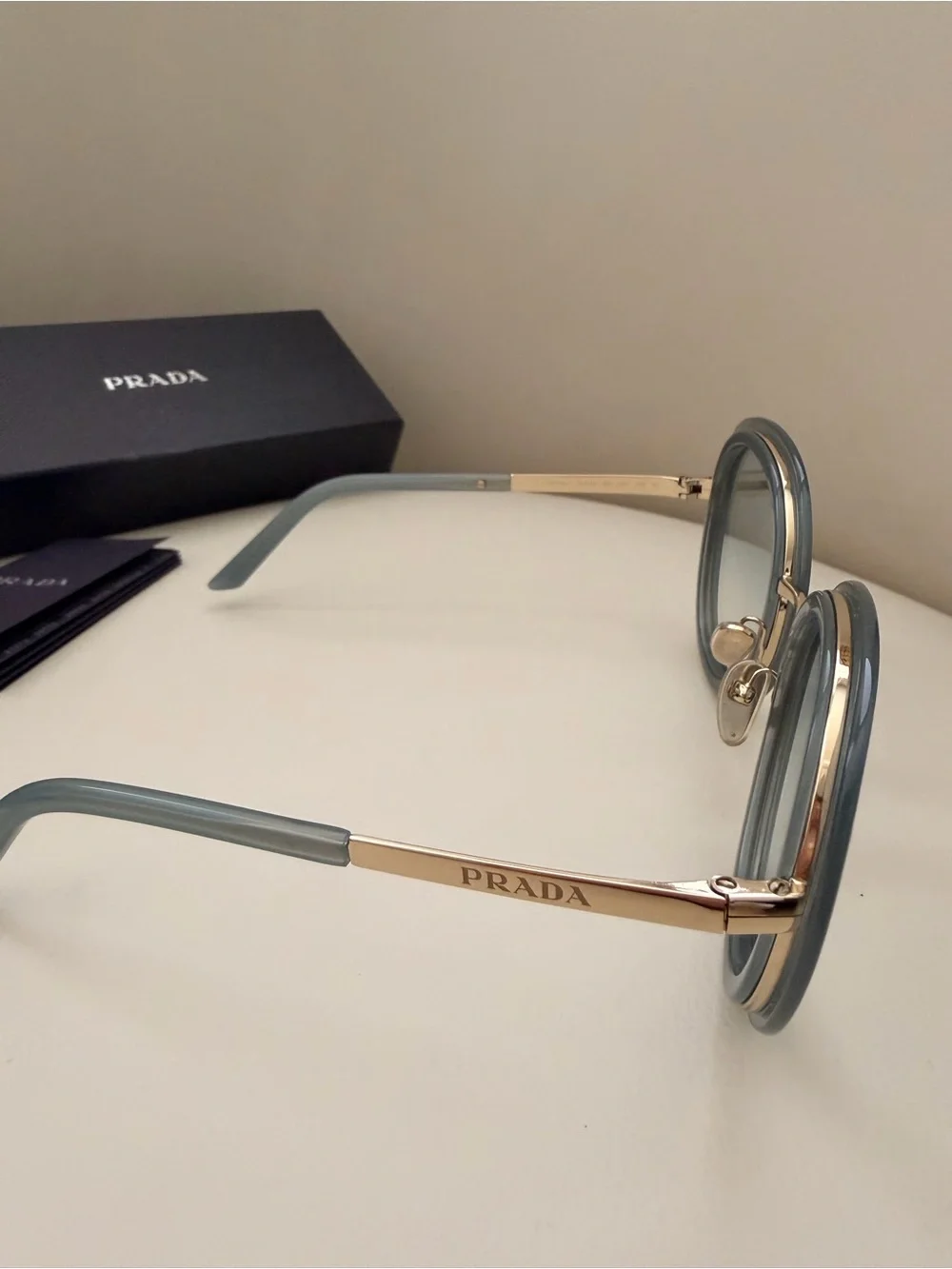 Prada 100% Round Sunglasses in Light Grey with Gold Trim
